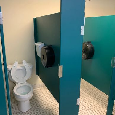 A bathroom being cleaned in a shopping center