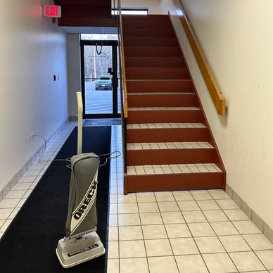 Commercial cleaning service tidying up a messy lobby