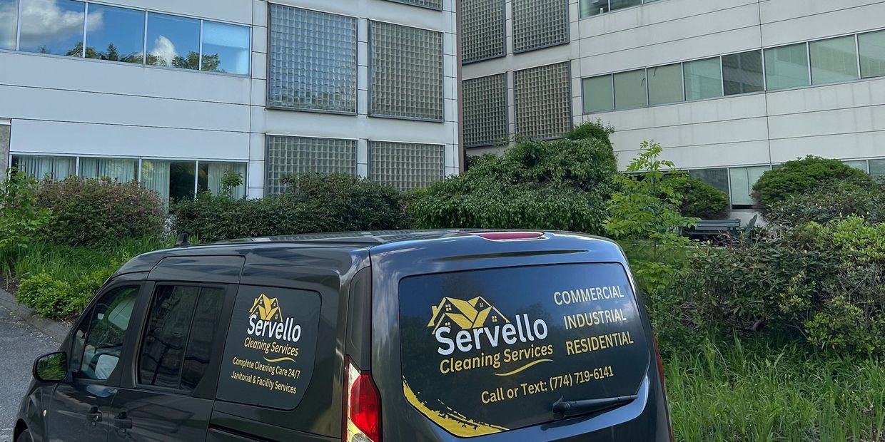 professional cleaning van parked by building