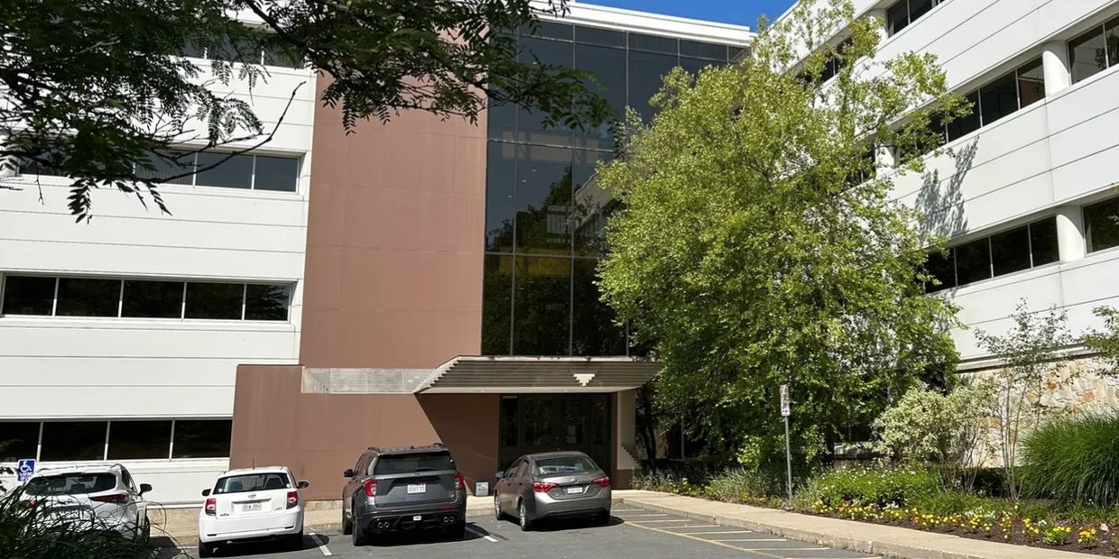 Commercial office in Springfield MA with landscaping and cars parked out front