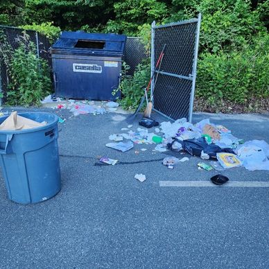 Trash being picked up at a plaza