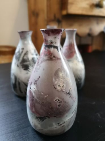 Saggarfired bud vases with organic materials for surface decoratin