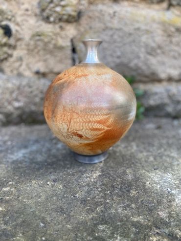 Wild clays and silver necked vessel with fern decoration