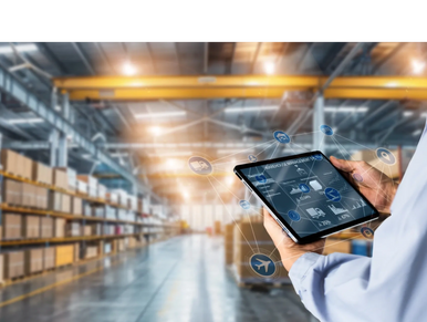 a man using a tablet in a warehouse