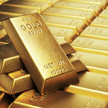 Stack of gold bars with one prominent gold bar.