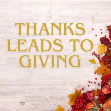 Thanksgiving theme with text and autumn decorations.