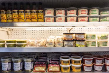 Peter Luger Creamed Spinach, sweet kosher pickles, specialty cheeses and more in the refrigerator