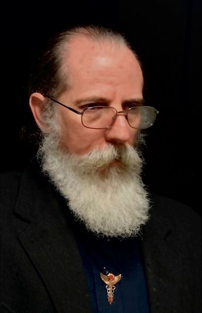 Dr. Laurent Colvin, DC is the creator of the America Eclipsed Tarot.