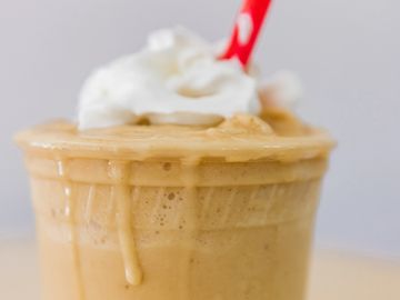 Peanut Butter & Banana Smoothie topped with Whipped Cream.  