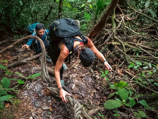 Girl hiking in the jungle of Sumatra
