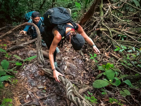 Girl climbing in the jungle of Sumatra