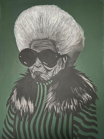 Stylish elderly woman with white hair and large sunglasses.