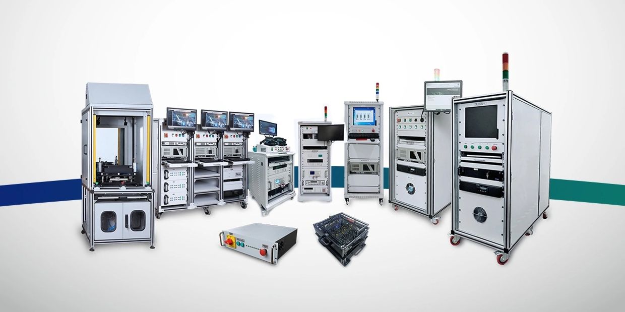 A lineup of advanced industrial testing and automation equipment with multiple monitors and control panels.