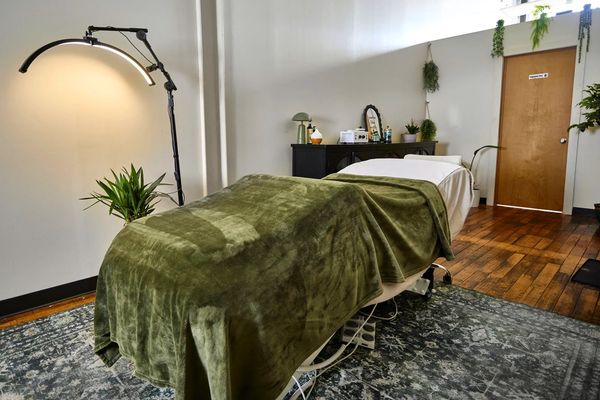 Spacious esthetics treatment room designed for relaxing skincare and facial treatments.