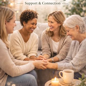 Supportive group coaching session with warm connection and smiles.