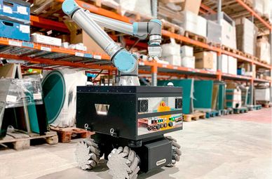 Autonomous warehouse robot equipped with a robotic arm and mecanum wheels.