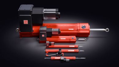 A lineup of red hydraulic cylinders of various sizes on a dark background.