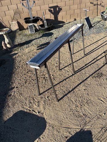 A aluminum trough was made for the birds to bathe and play in. Also a source of clean water.
A sol