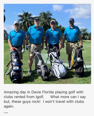 Four men in matching blue shirts with golf bags on a sunny golf course.