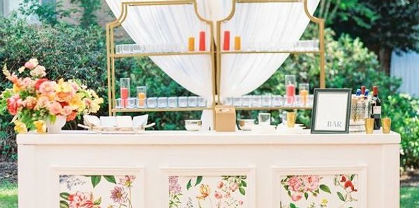 Elegant outdoor floral-themed bar setup.