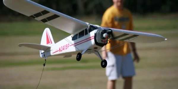 A remote-controlled model airplane in flight.