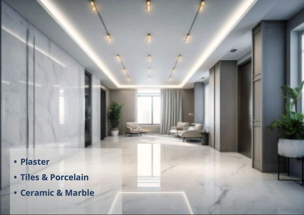 Modern lobby with marble floors, sleek lighting, and comfortable seating.