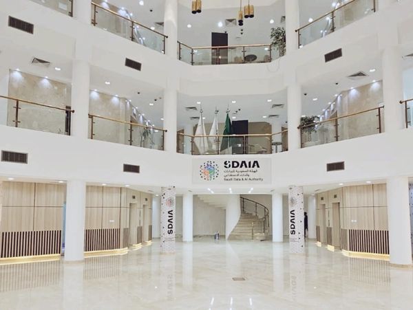 Spacious, modern atrium of the Saudi Data & AI Authority headquarters.