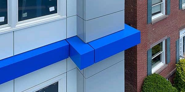 Grey and blue ACM application on walls and fascia