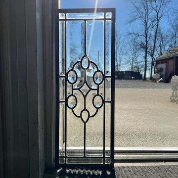 Small non directional vintage leaded glass windows with intricate beveled details. 2 available