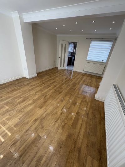 Empty room with wooden flooring and recessed ceiling lights. end of tenancy deep clean swansea