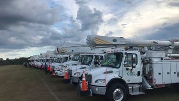 Utility crews on standby during a storm call