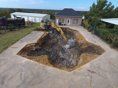 Complete pool removal using 315 cat "big machine " saving as much deck as possible.