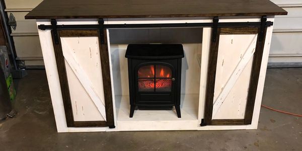 entertainment center with barn doors