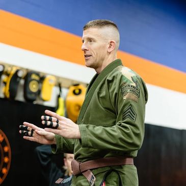 Atlas Brazilian Jiu-Jitsu coach instructing a class in Alexandria, Virginia.