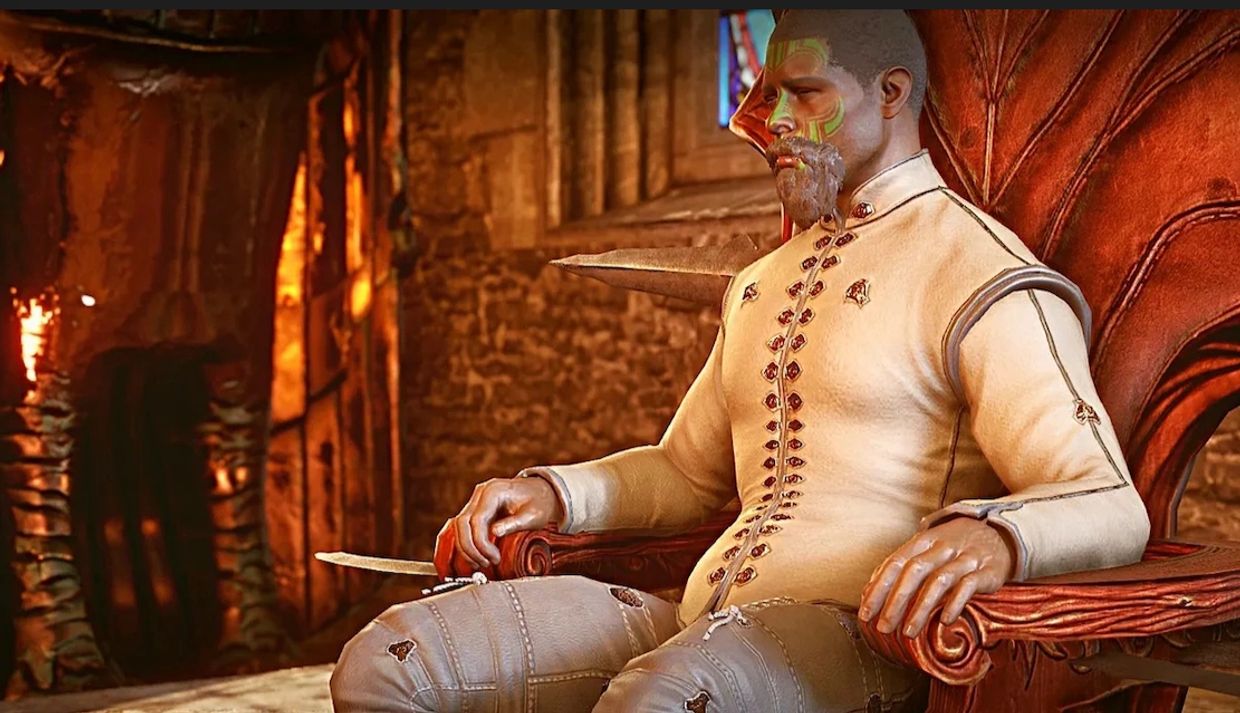 A man with face paint sits on an ornate wooden chair in a rustic room.