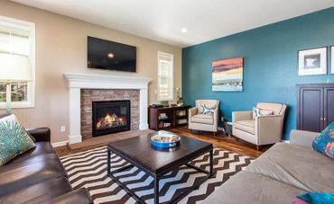 living room with teal wall