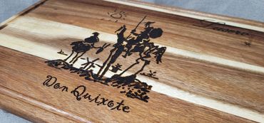 Graffeetie's laser-engraved Don Quixote and other classic artwork on a custom wood board.