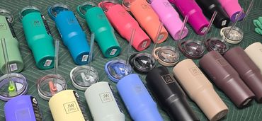 Graffeetie's laser-engraved stainless steel tumblers with personalized designs in vibrant colors.