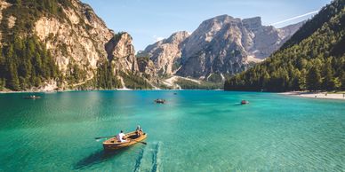 Canoeing across a lake in the mountains