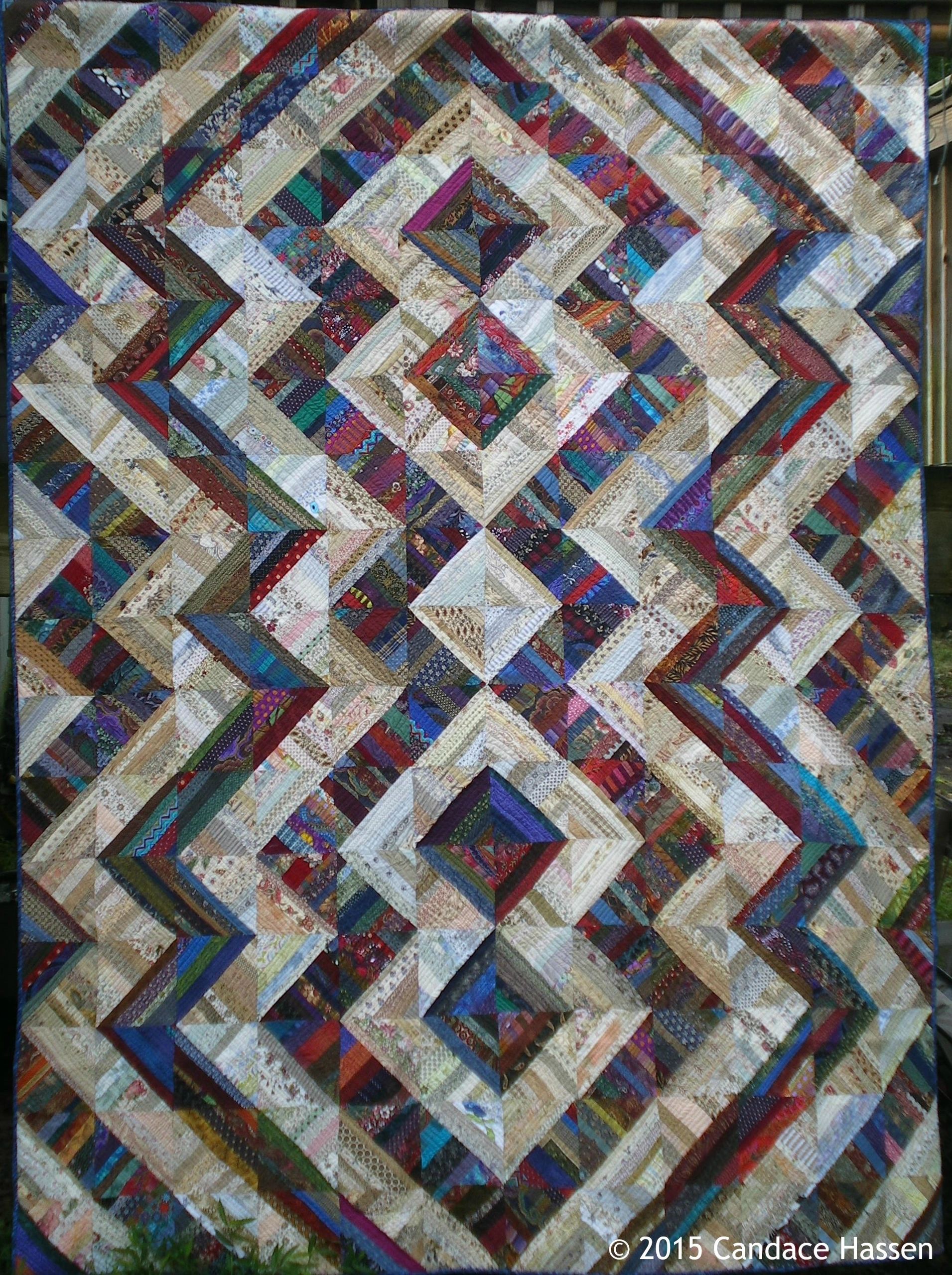 Full size Scrappy quilt in light and dark prints