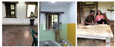 People exploring and working inside a historic building with wooden windows and old furniture.