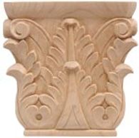 Intricately carved wooden capital with acanthus leaf design.