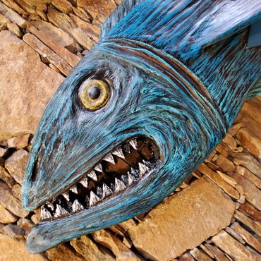 Surfboard Taxidermy carving by artist Michael Clineman.