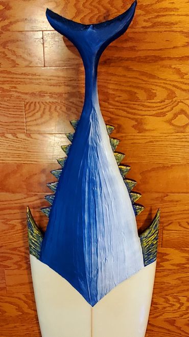 Surfboard Taxidermy carving of a Tuna Tail by artist Michael Clineman.
