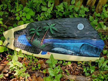 Surfboard Taxidermy carving of a Nighttime Beach Scene by artist Michael Clineman.