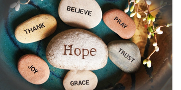 stones and rocks with affirmations of hope, trust, joy, pray, believe, grace, thankfulness