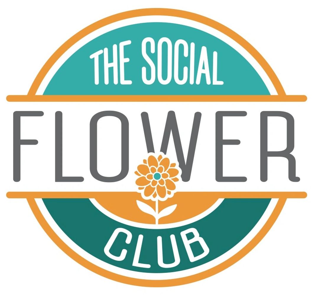 Stack of books next to pencils in a holder and a camera.