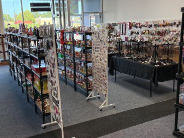 Interior of a collectible and jewelry shop with shelves and displays.