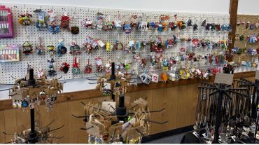Various ornaments and accessories hanging on display racks.