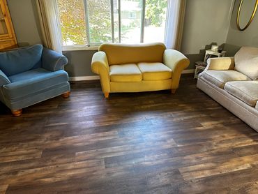 Carpet removed, luxury vinyl plank flooring installed for a modern look.